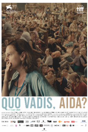 Poster showing Aida in front of a warehouse of refugees.
